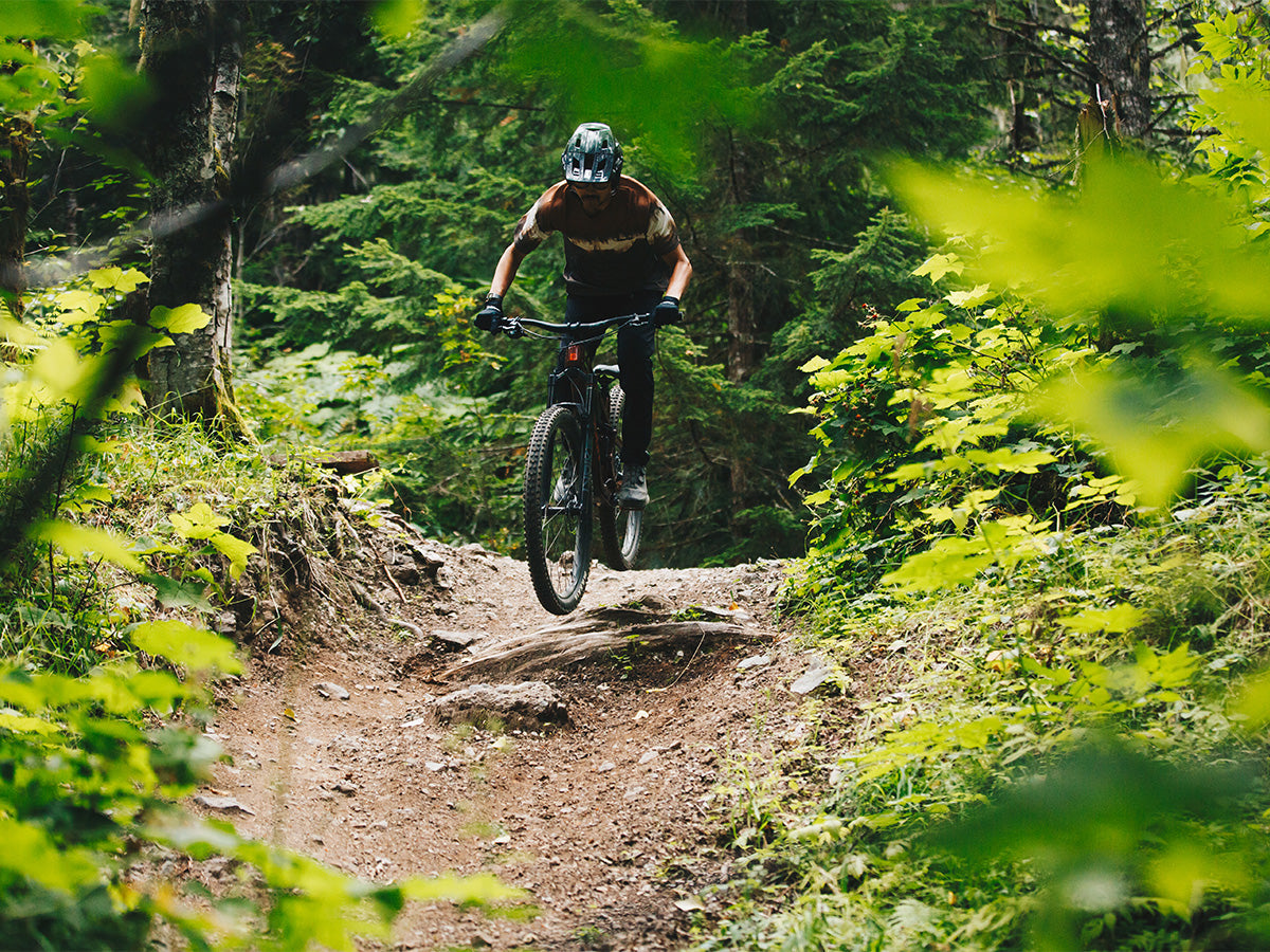 man riding full-suspension MTB