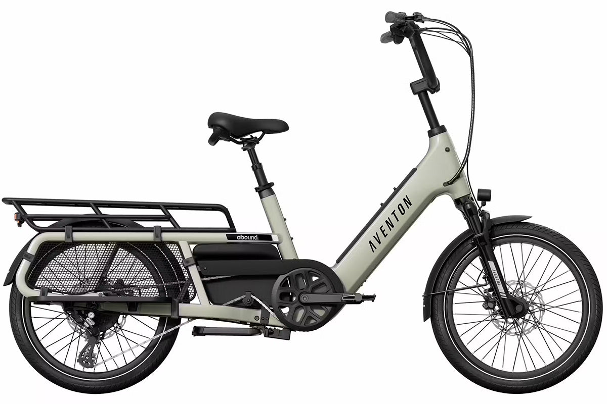 Aventon Abound LR cargo eBike with a child seat and cargo bags on the long rear rack.
