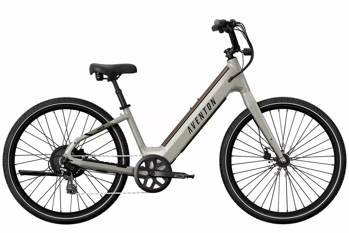 Aventon Pace 4 cruiser eBike being ridden on a boardwalk or paved path.